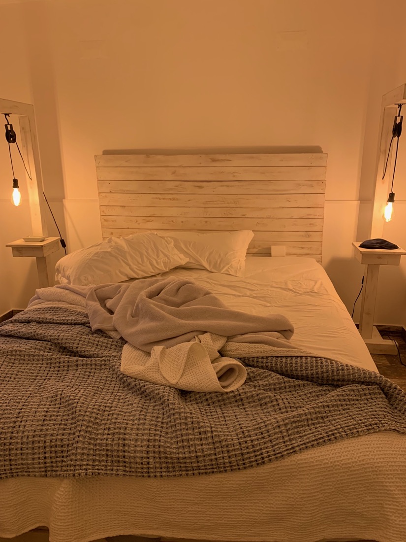 A softly lit bed