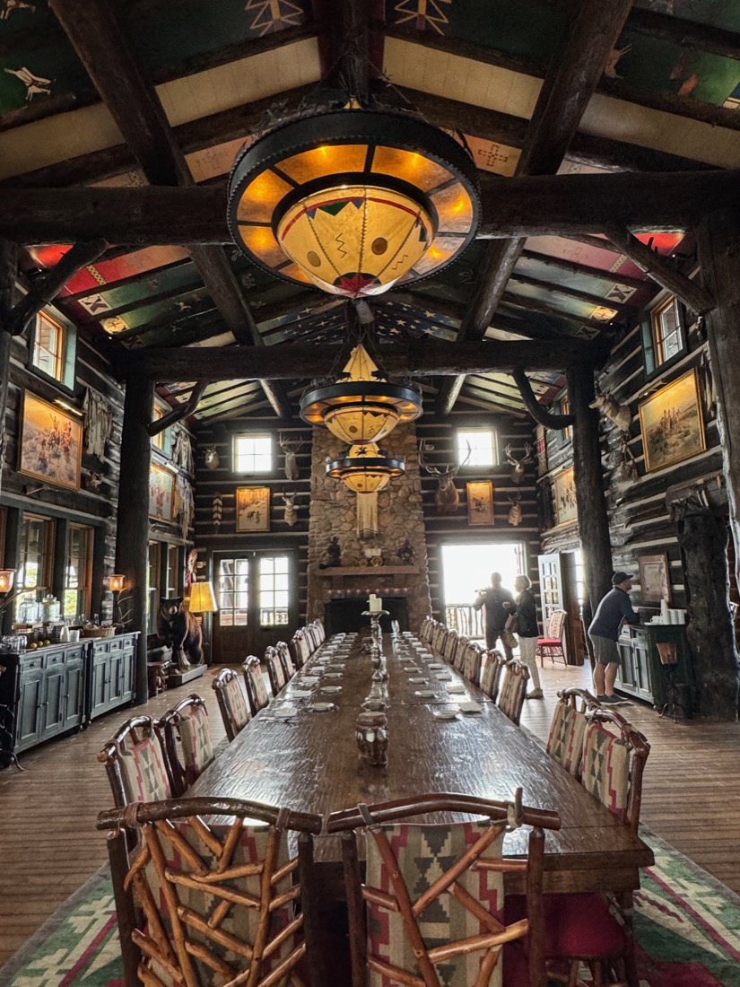 A grand candlelit lodge dining hall