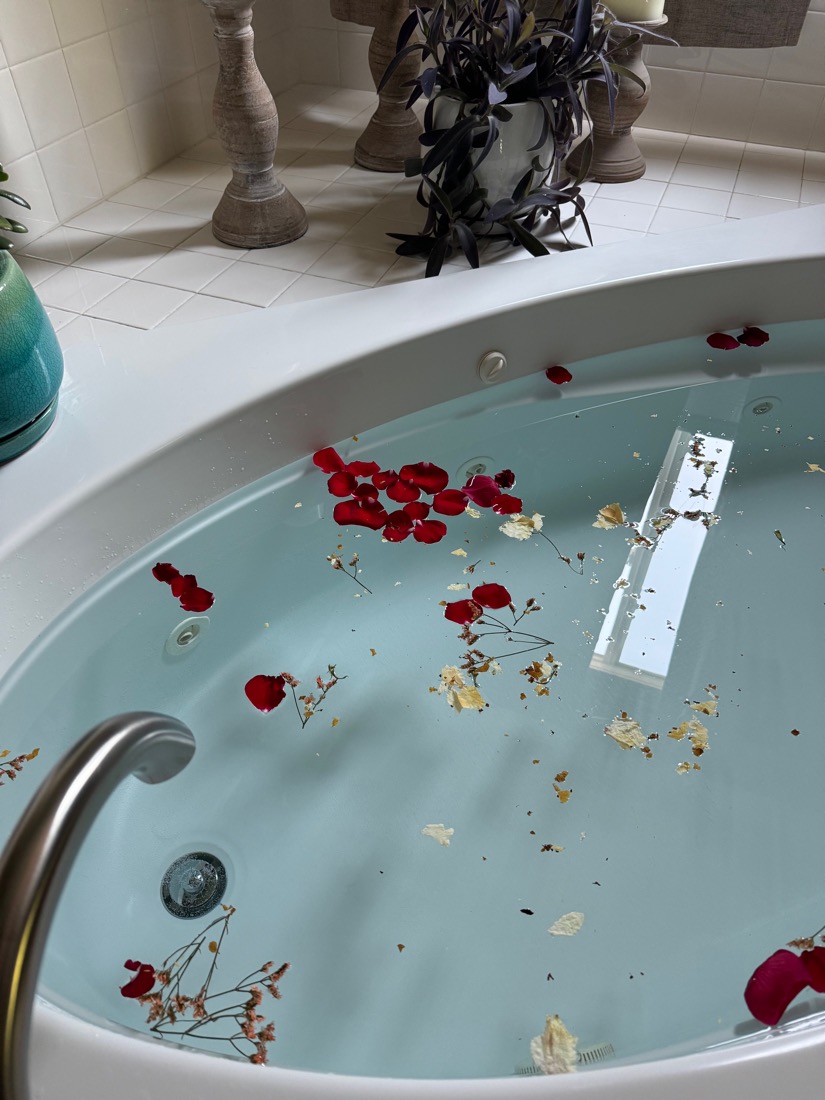 A bath scattered with rose petals